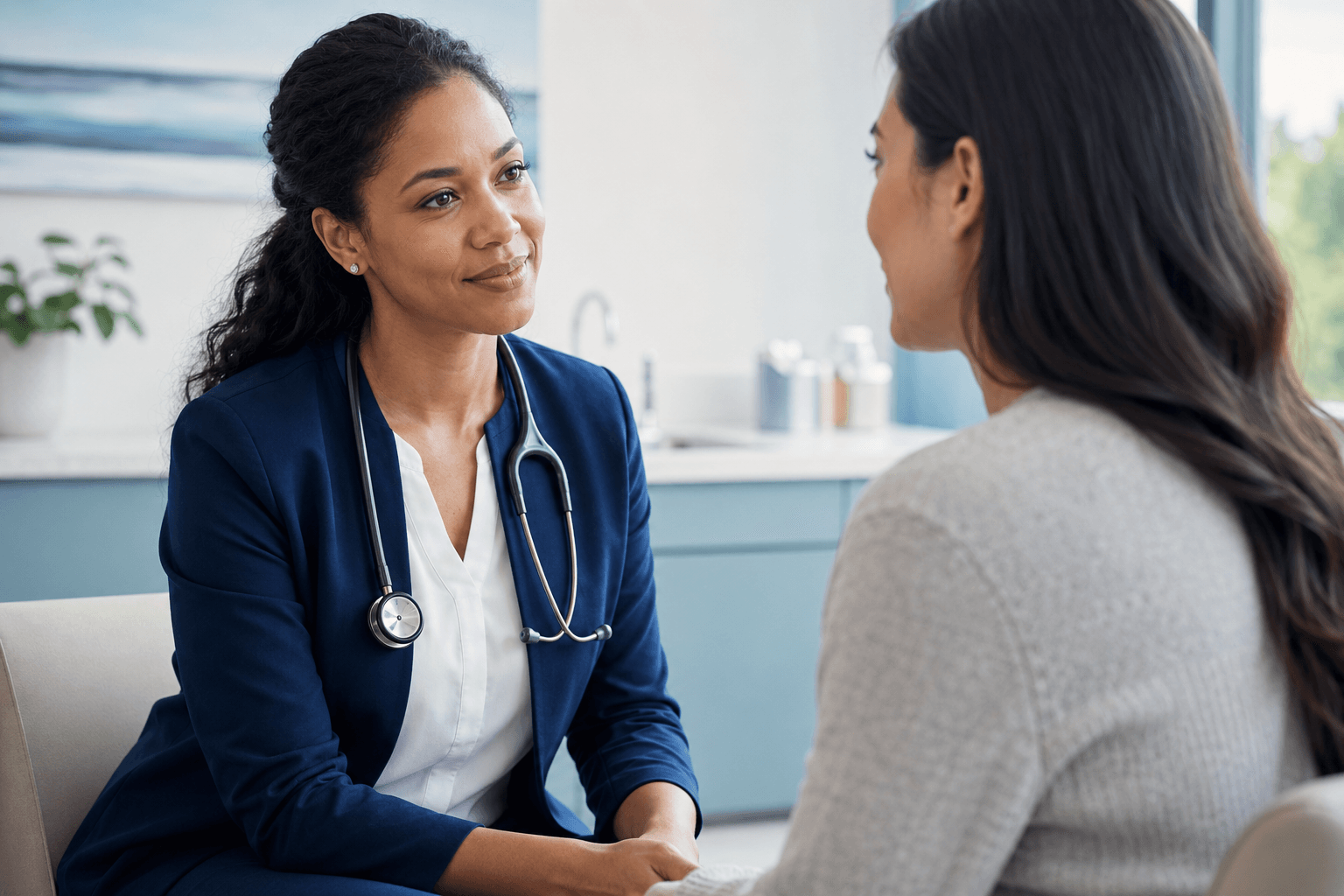A physician listening to a patient during a primary care visit